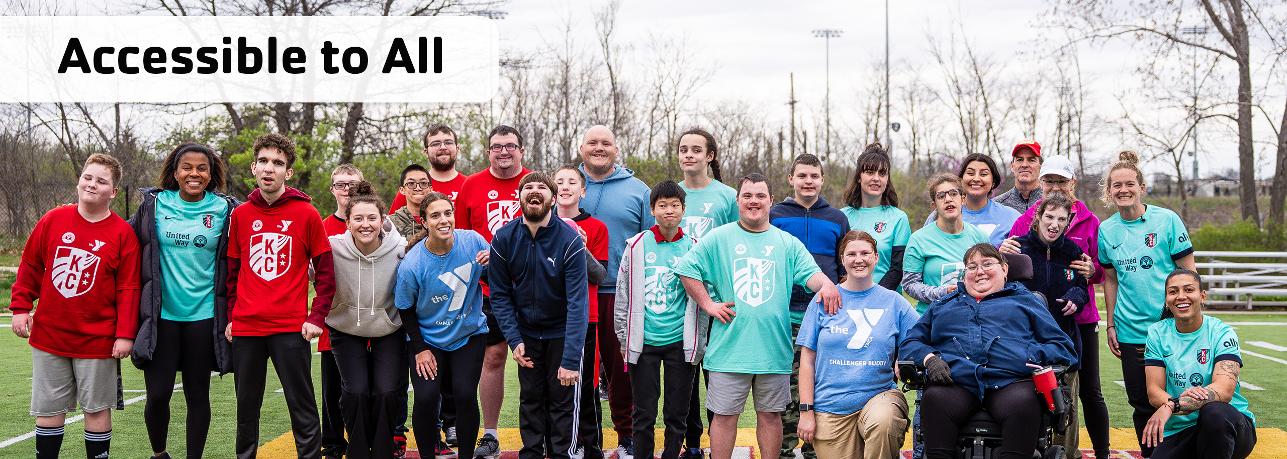 Accessible to All, group picture of our challenger athletes posing with their volunteer buddies, and athletes from the KC Current after a soccer game at the Challenger Complex