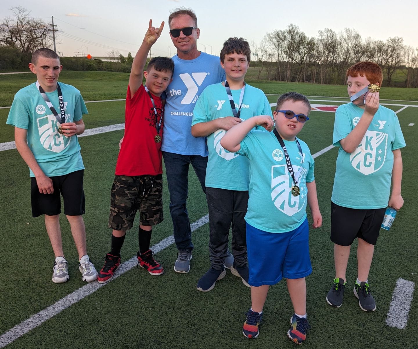Group picture of a buddy and several challenger athletes