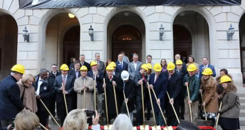 Project leaders gather with shovels to break ground at the new Kirk Family YMCA site.