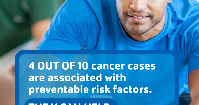 Kansas City YMCA graphic featuring a YMCA member working out on an exercise bike with a text overlay saying "4 out of 10 cancer cases are associated with preventable risk factors".