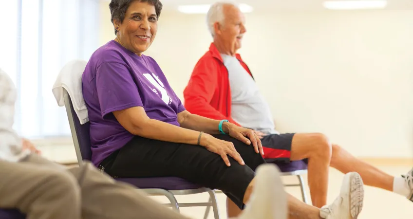 Active Older Adults preform exercises while seated in a Greater Kansas City YMCA.