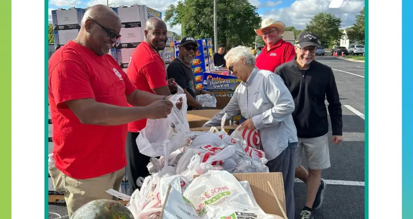 Picture of Y volunteers at a food distribution event in the KC metro. Text: "2024 Bayer Fund grant recipient"