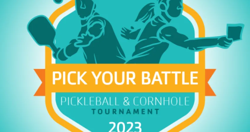 Two illustrated people are side by side, one is playing pickleball and one is playing cornhole. Text says "Pick Your Battle Pickleball and Cornhole Tournament 2023.