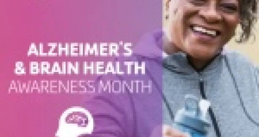 An older woman is smiling at the camera and is holding a water bottle. Graphic text says "Alzheimer's and Brain Health Awareness Month at the Y.