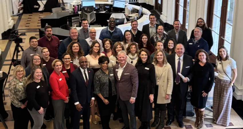 Group photo at the 165th anniversary time capsule dedication ceremony in the lobby of the Kirk Family YMCA