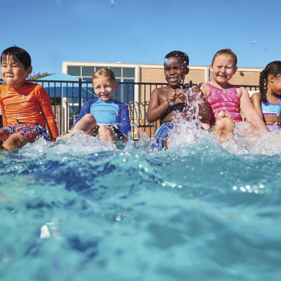 children playing together in pool