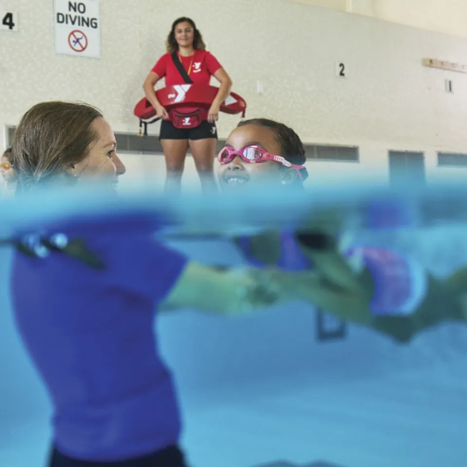 youth swim lessons while lifeguard watches on