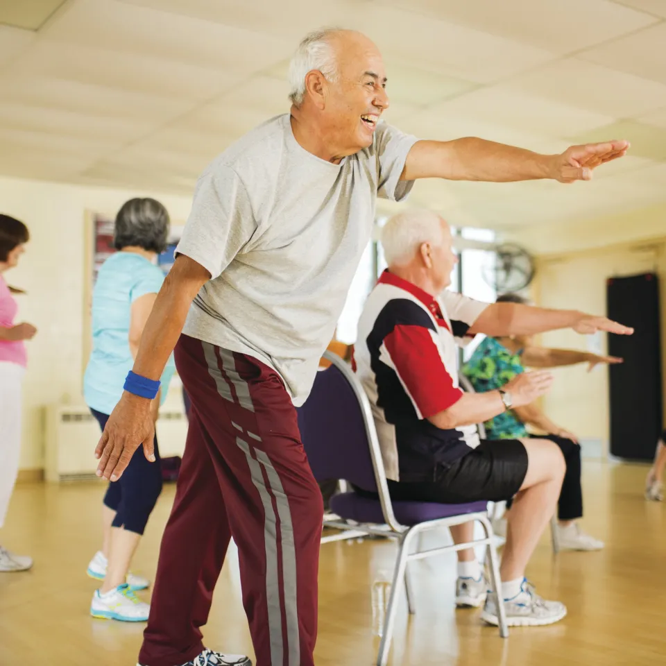 Active older Kansas City YMCA members exercising in a Kansas City YMCA class.