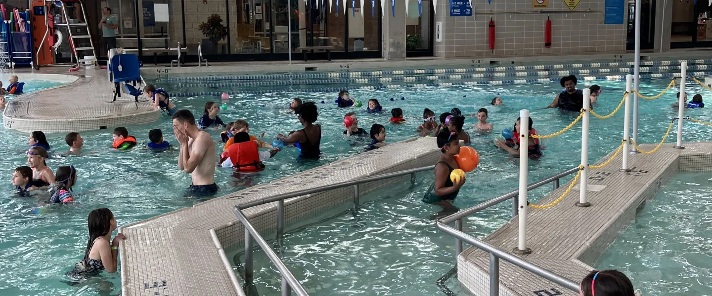 Campers enjoy a weekly field trip swimming at the North Kansas City YMCA.