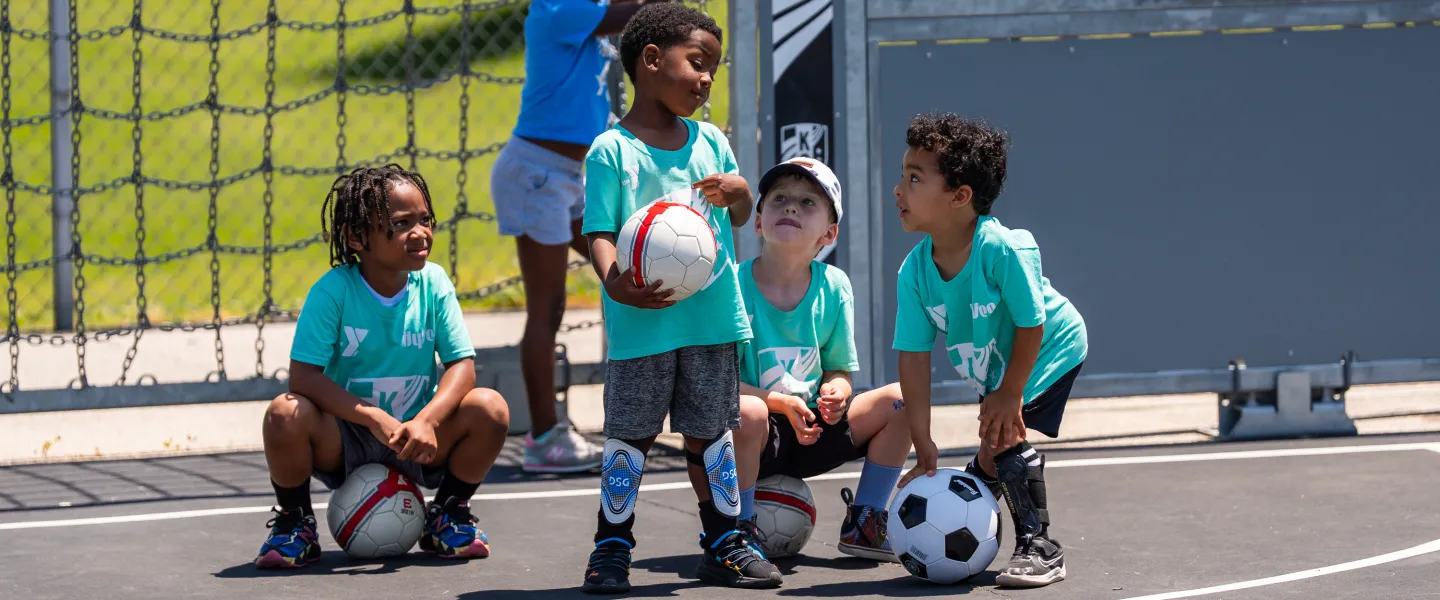 Photo of bitty athletes playing soccer.