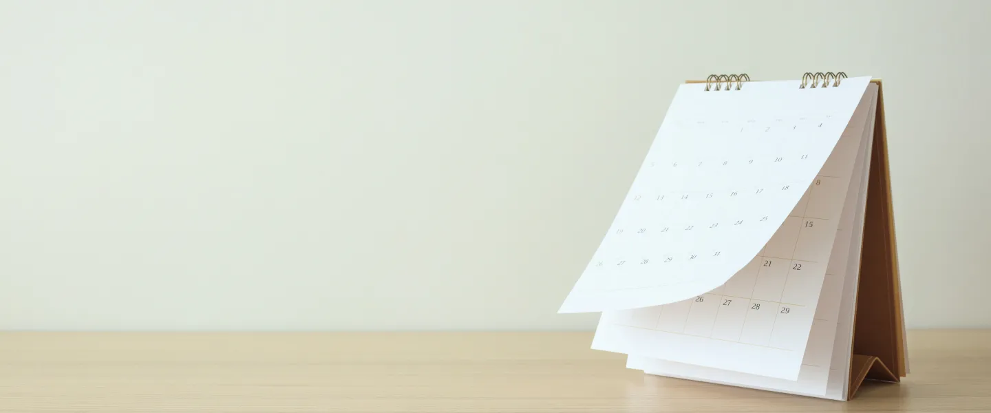 Photo of a calendar on a desk.