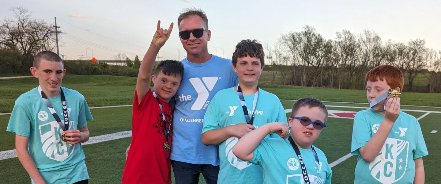 Group picture of a buddy and several challenger athletes
