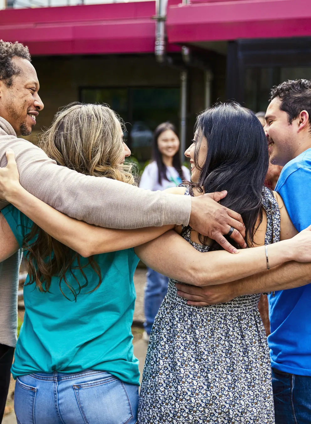 Photo of YMCA members hugging and smiling