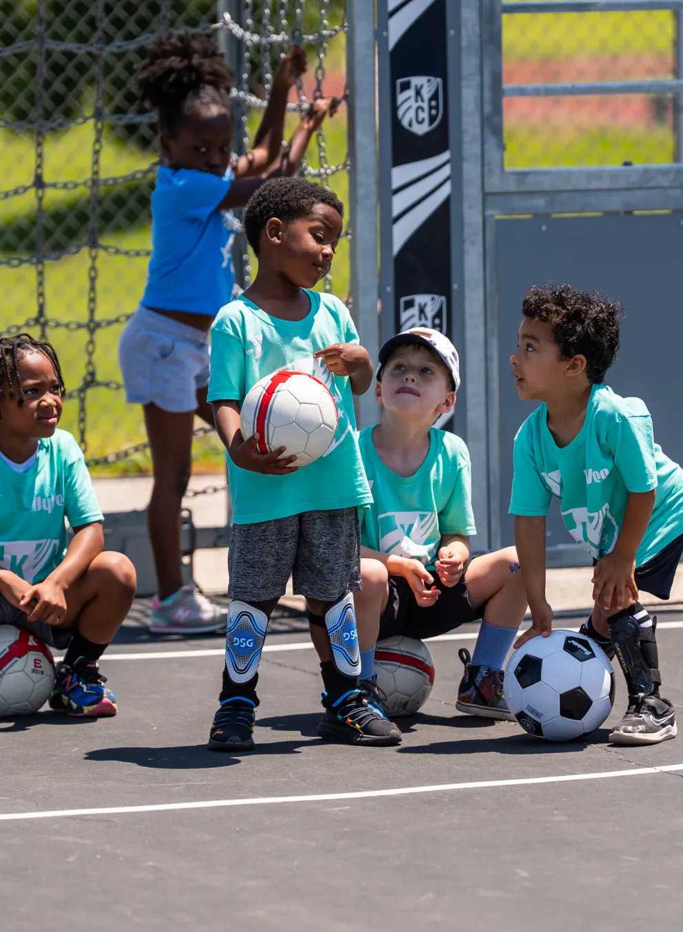 Photo of bitty athletes playing soccer.