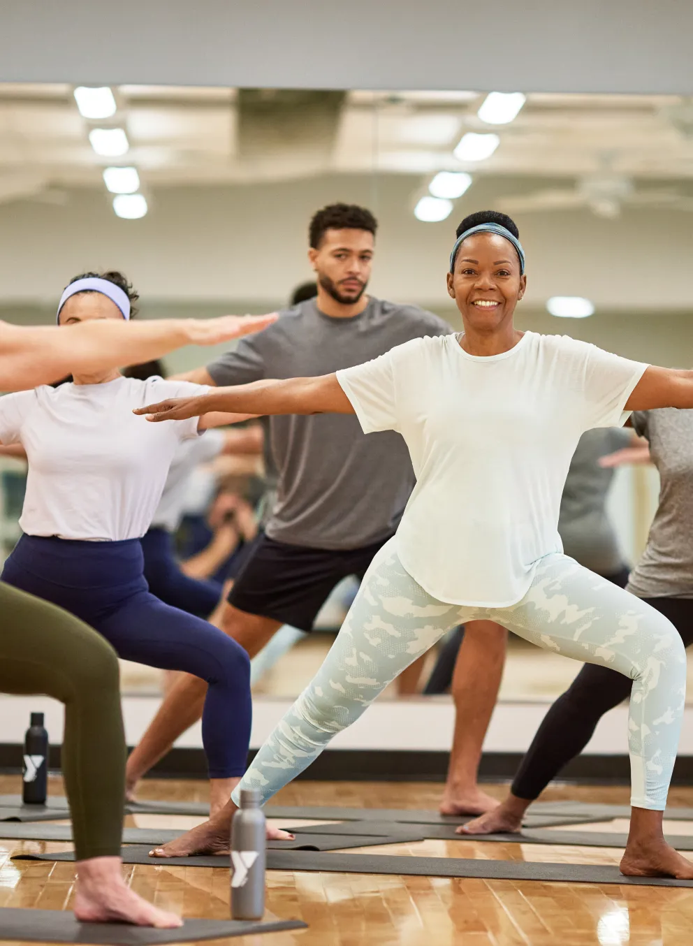Photo of a yoga group class.