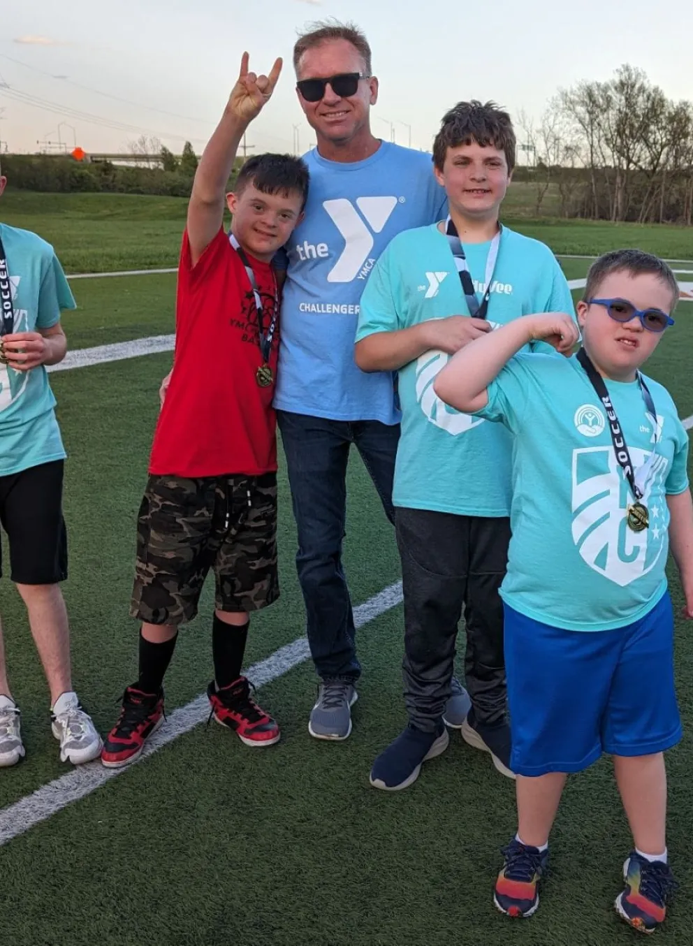 Group picture of a buddy and several challenger athletes