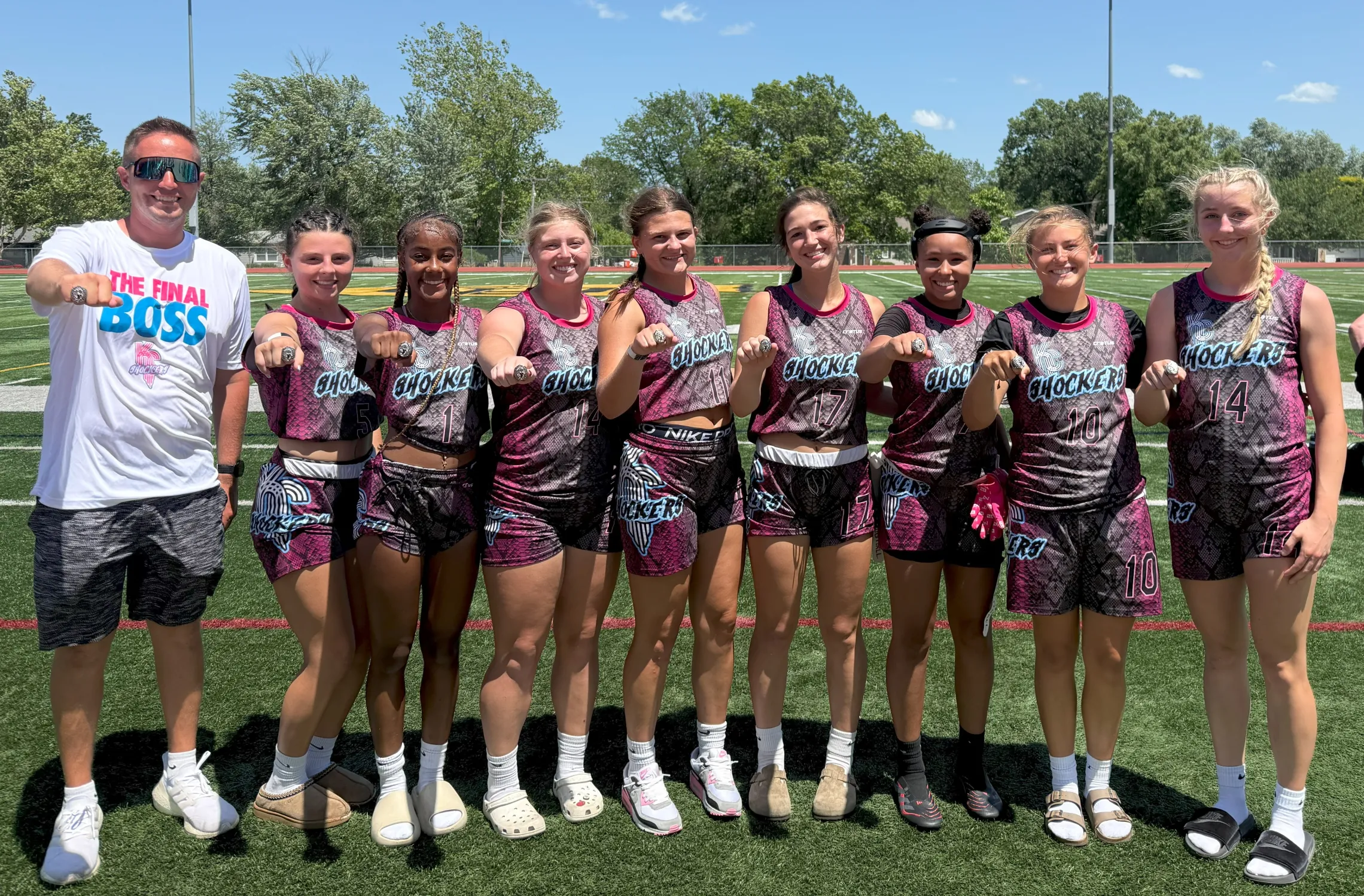 Photo of tournament champions KC Shockers high school team from the YMCA of Greater Kansas City, wearing their championship rings