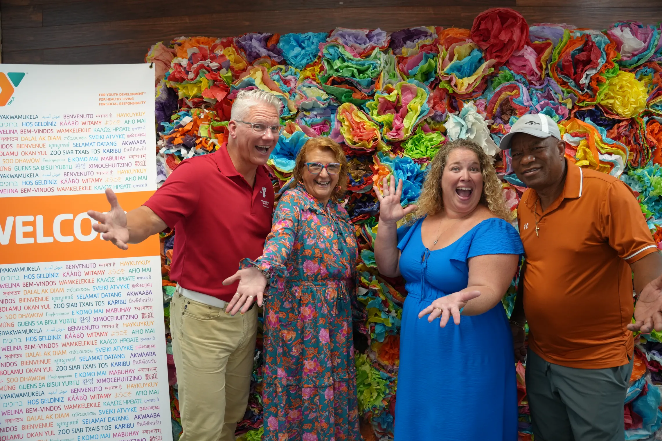 Photo of CEO and President, Mark Hulet, New American Welcome Center Coordinator Aracely Van Kirk, North Kansas City YMCA Executive Director Andrea Toney, and Mene.