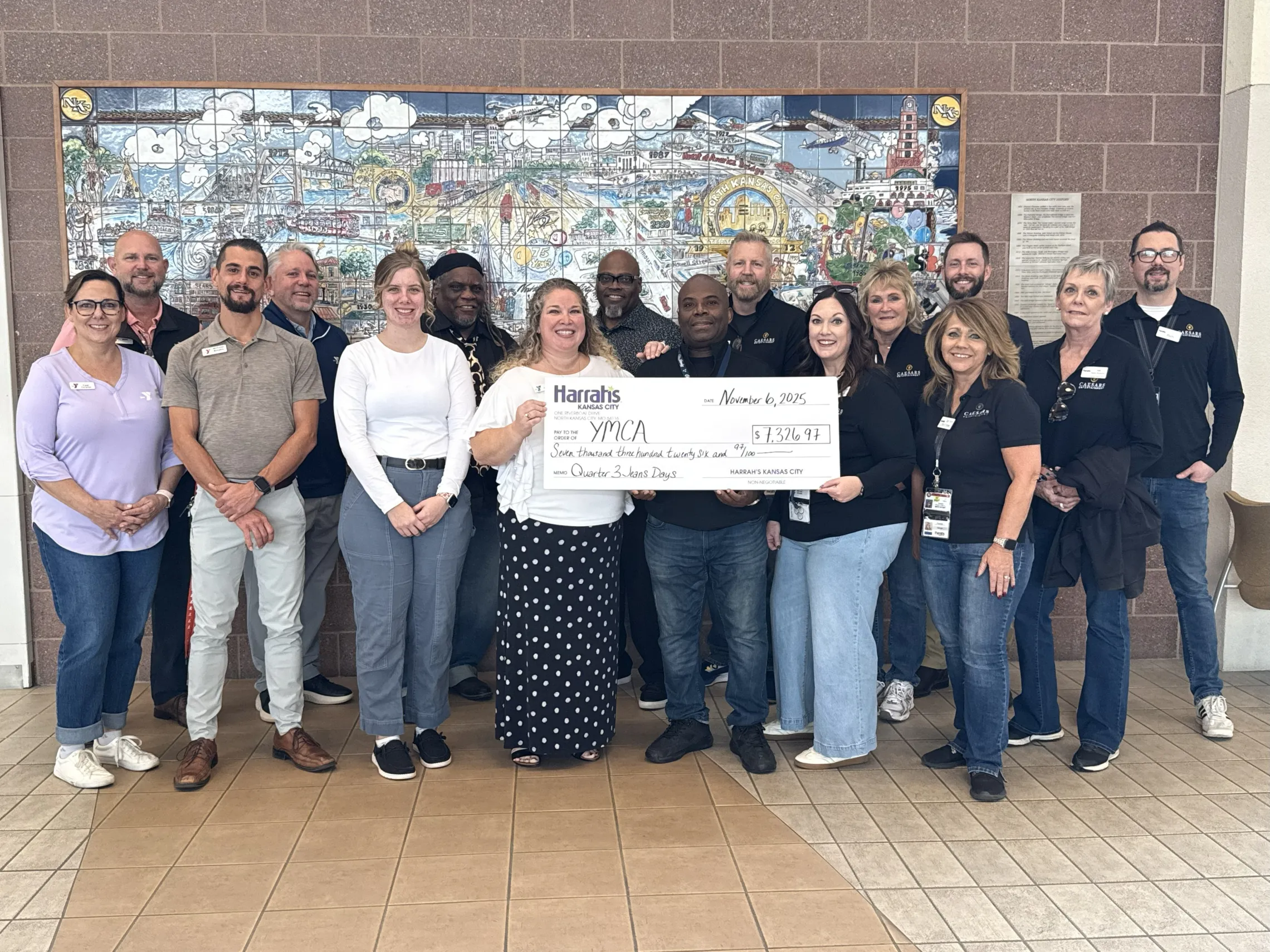 Check presentation from Harrah's to North Kansas City YMCA executive director Andrea Toney. Photo includes North Kansas City Mayor Jesse Smith, Harrah's Casino team members and YMCA staff.