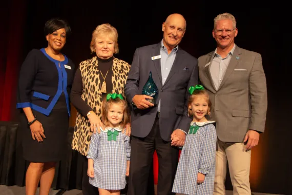Photo of Chief Volunteer Officer Dr. Andrea Hendricks, Libby and Allen Blair, Mark Hulet, and the Blairs' granddaughters