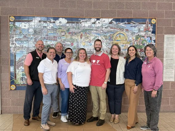 Group photo of North Kansas City YMCA executive director Andrea Toney, North Kansas City Mayor Jesse Smith, and YMCA and UnitedHealthcare representatives