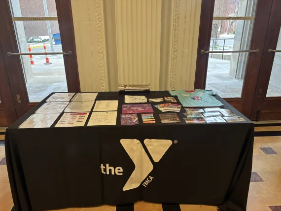 Photo of table shows items on display and the time capsule the items went into