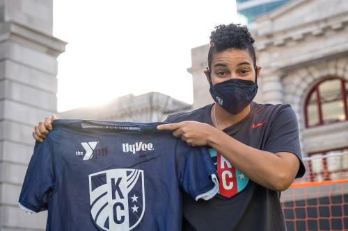 KC Current Goalkeeper Adrianna Franch holds the YMCA KC Current youth soccer jersey