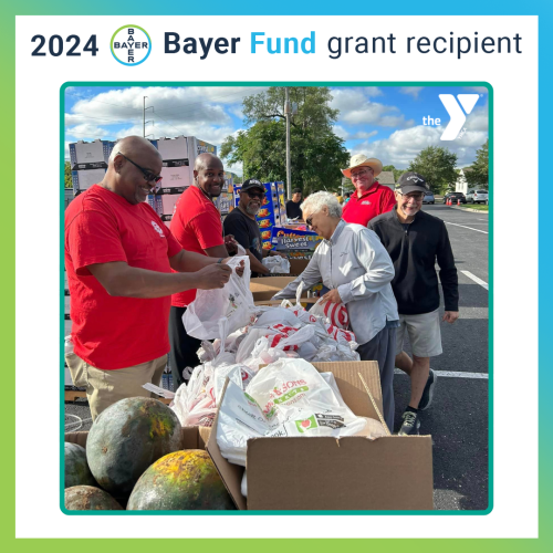Picture of Y volunteers at a food distribution event in the KC metro. Text: "2024 Bayer Fund grant recipient"