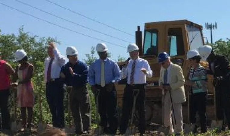 Leaders from the Y and Truman Medical Center break ground together at the new clinic site. 