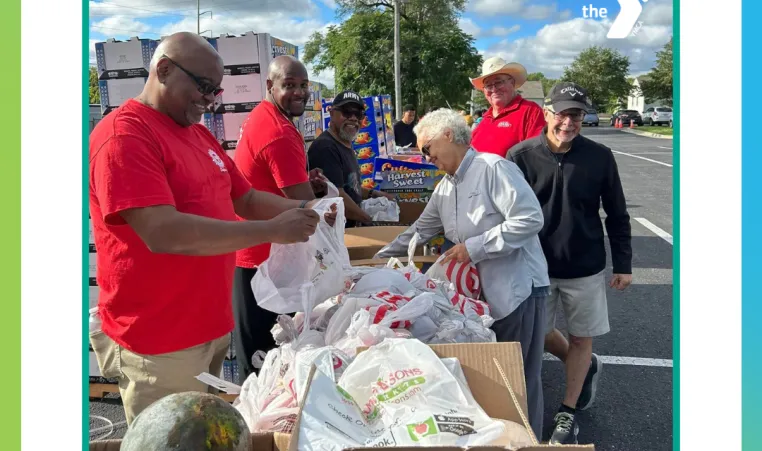 Picture of Y volunteers at a food distribution event in the KC metro. Text: "2024 Bayer Fund grant recipient"