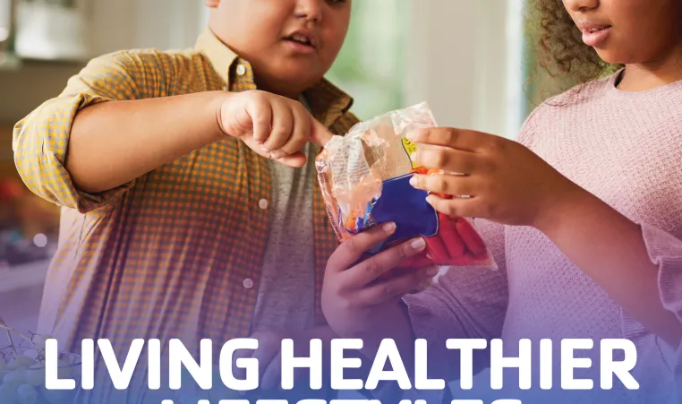 Two young people look at a bag of carrots to read the nutrition info. Text: "Living healthier lifestyles, diabetes awareness month"