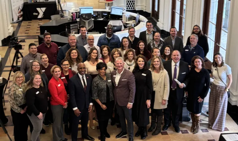 Group photo at the 165th anniversary time capsule dedication ceremony in the lobby of the Kirk Family YMCA