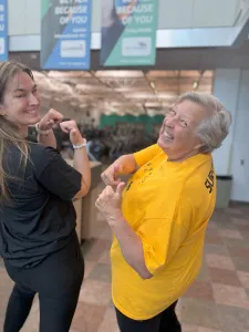 image of cancer survivor and her LIVESTRONG coach Smiling together