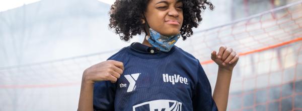 YMCA youth athlete shows off the new YMCA KC Current youth soccer jersey